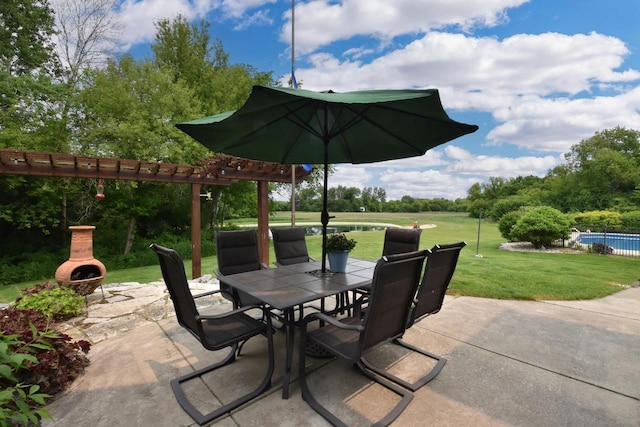 W395S3611 Hardscrabble Rd, Dousman, WI 53118 - view of patio featuring outdoor dining area, exterior fireplace, an outdoor pool, and view of scattered trees