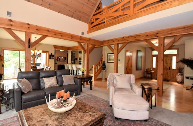 W395S3611 Hardscrabble Rd, Dousman, WI 53118 - carpeted living area with stairway, a chandelier, and high vaulted ceiling