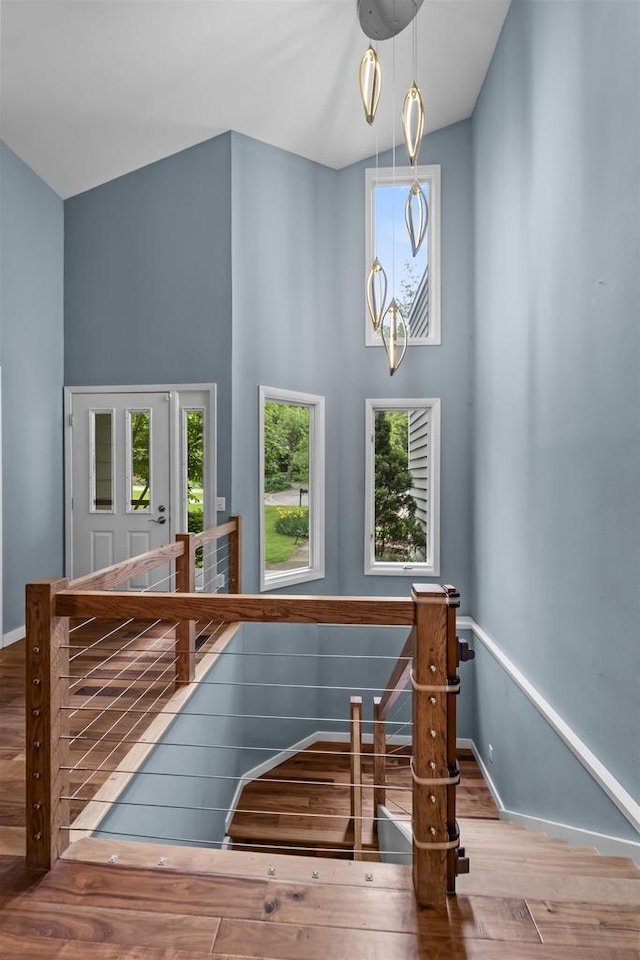 1733 Camelot Dr, Madison, WI 53705 - stairs with wood finished floors, plenty of natural light, a high ceiling, and baseboards