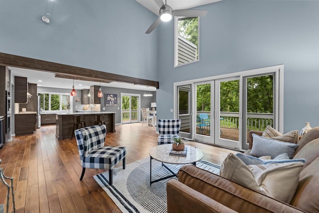 1733 Camelot Dr, Madison, WI 53705 - living area featuring french doors, a towering ceiling, hardwood / wood-style floors, and a ceiling fan