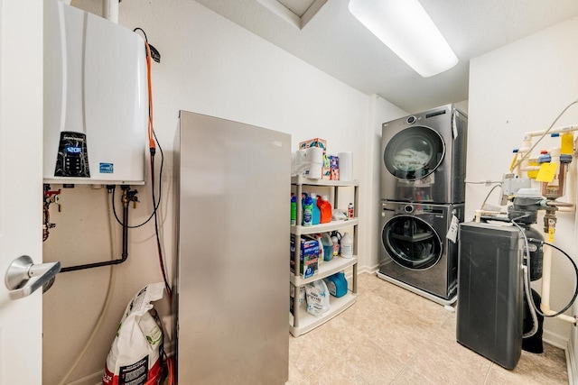 N17W26535 Meadowgrass Cir Unit G, Pewaukee, WI 53072 - laundry area featuring stacked washer / dryer and water heater