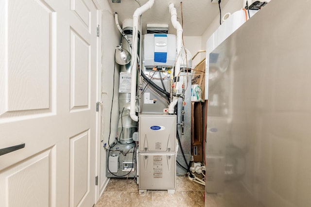 N17W26535 Meadowgrass Cir Unit G, Pewaukee, WI 53072 - utility room with heating unit