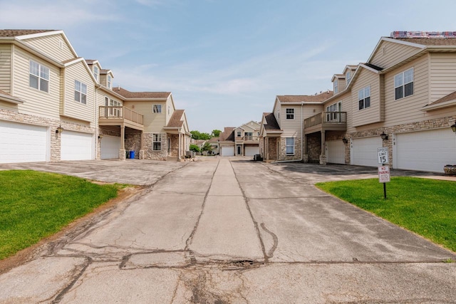 N17W26535 Meadowgrass Cir Unit G, Pewaukee, WI 53072 - view of asphalt road with a residential view