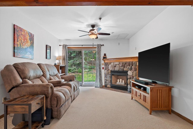1507 Clarence Ct Unit 5, West Bend, WI 53095 - living room featuring light colored carpet, ceiling fan, a fireplace, and baseboards