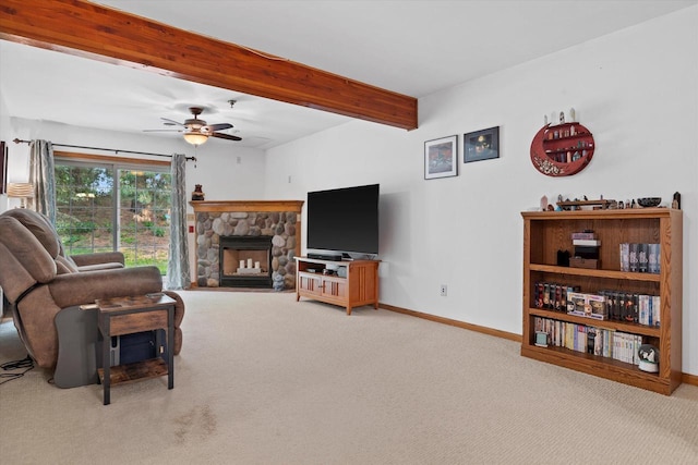 1507 Clarence Ct Unit 5, West Bend, WI 53095 - living area featuring carpet, beam ceiling, baseboards, a ceiling fan, and a fireplace