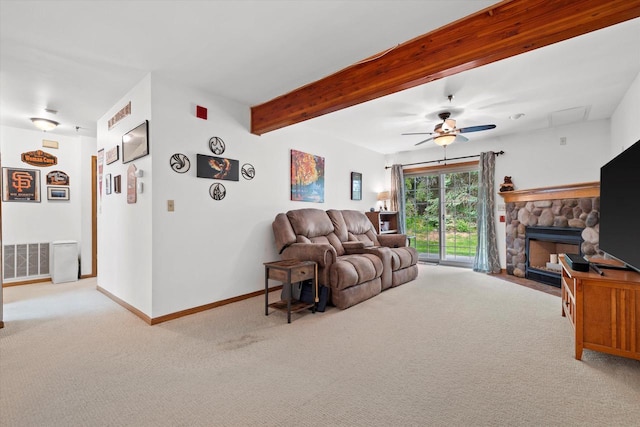 1507 Clarence Ct Unit 5, West Bend, WI 53095 - carpeted living room with a fireplace, a ceiling fan, baseboards, and beamed ceiling