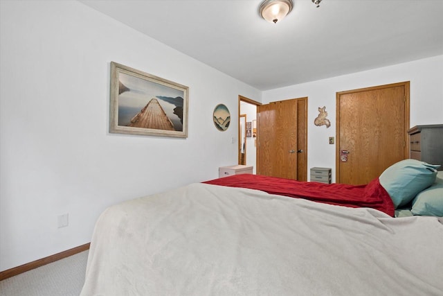 1507 Clarence Ct Unit 5, West Bend, WI 53095 - bedroom featuring carpet and baseboards