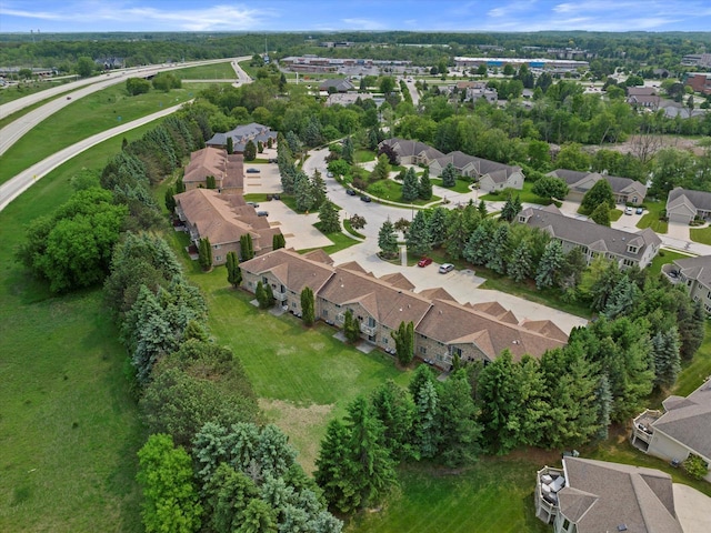 1507 Clarence Ct Unit 5, West Bend, WI 53095 - aerial overview of property's location featuring nearby suburban area and a tree filled landscape
