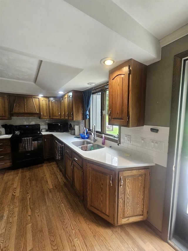 5317 Old C Rd, Boscobel, WI 53805 - kitchen with black appliances, a sink, light countertops, backsplash, and recessed lighting