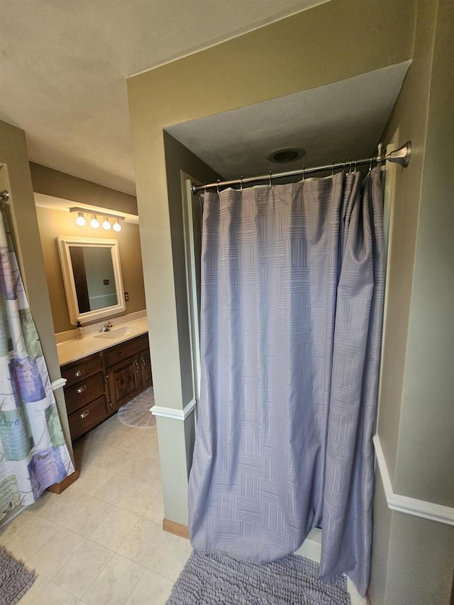 5317 Old C Rd, Boscobel, WI 53805 - bathroom featuring vanity, a shower with shower curtain, and tile patterned floors