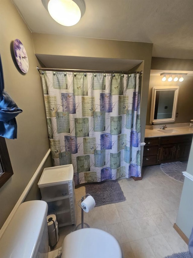 5317 Old C Rd, Boscobel, WI 53805 - bathroom featuring vanity, toilet, a shower with shower curtain, and tile patterned floors