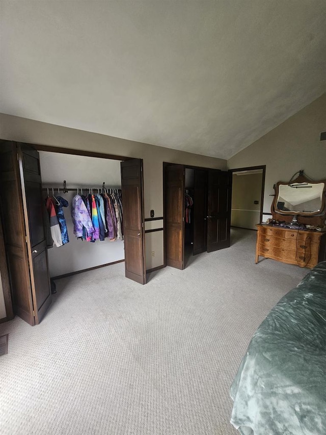 5317 Old C Rd, Boscobel, WI 53805 - bedroom with lofted ceiling, light carpet, and multiple closets