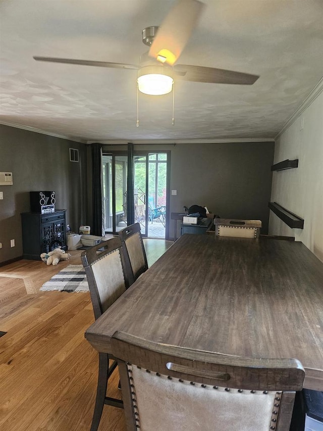 5317 Old C Rd, Boscobel, WI 53805 - dining area featuring crown molding, ceiling fan, and wood finished floors