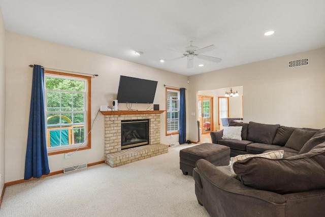 2432 Forest Hill Ct, Waukesha, WI 53188 - carpeted living area with ceiling fan, baseboards, recessed lighting, a fireplace, and a chandelier