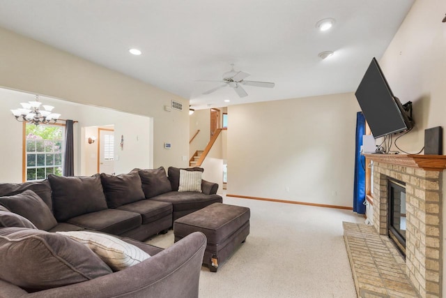 2432 Forest Hill Ct, Waukesha, WI 53188 - carpeted living room with a fireplace, ceiling fan, stairway, recessed lighting, and a chandelier