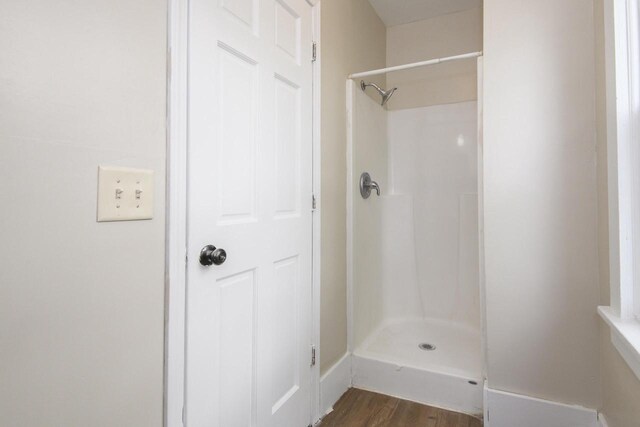912 Harvey St, Beloit, WI 53511 - full bath with a shower and wood finished floors