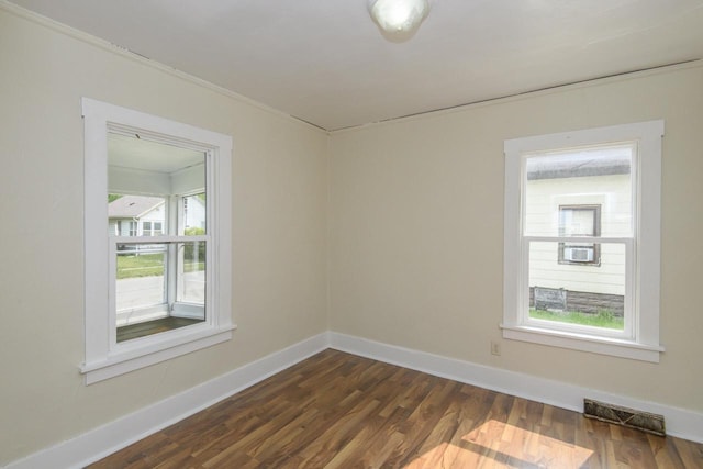 912 Harvey St, Beloit, WI 53511 - unfurnished room with dark wood finished floors, ornamental molding, and baseboards