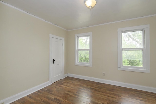 912 Harvey St, Beloit, WI 53511 - unfurnished room with ornamental molding, dark wood-style floors, and baseboards
