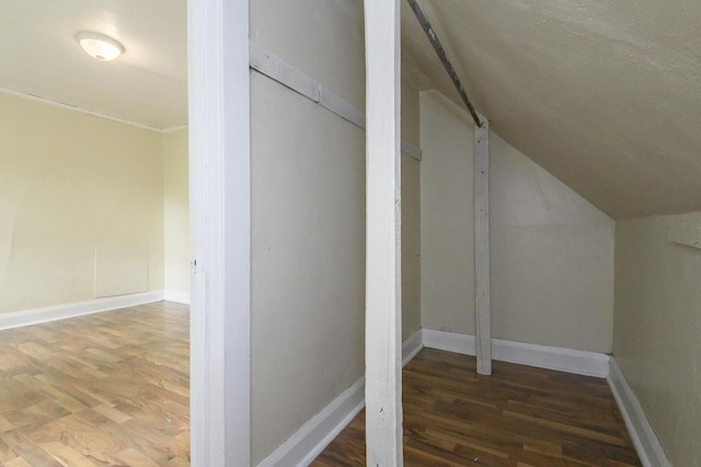 912 Harvey St, Beloit, WI 53511 - bonus room featuring wood finished floors, lofted ceiling, baseboards, and a barn door