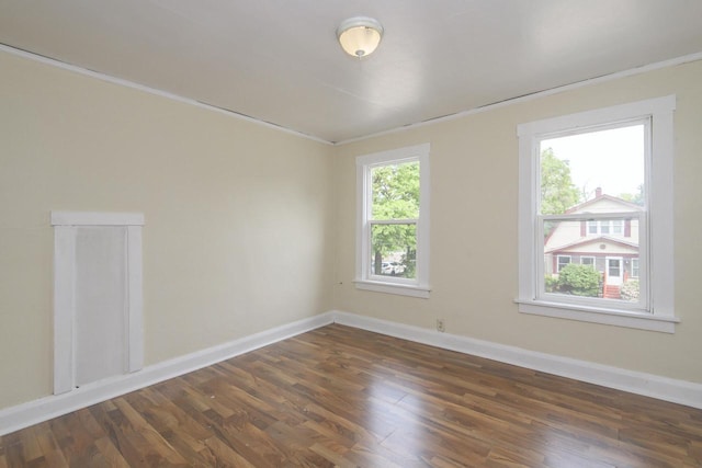 912 Harvey St, Beloit, WI 53511 - unfurnished room featuring wood finished floors, baseboards, and crown molding