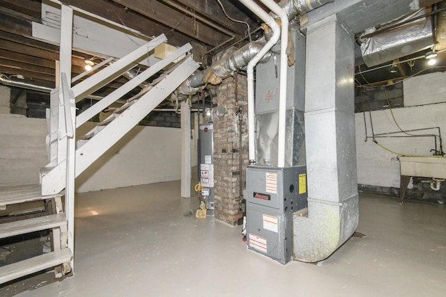 912 Harvey St, Beloit, WI 53511 - unfinished below grade area featuring gas water heater, a sink, and heating unit
