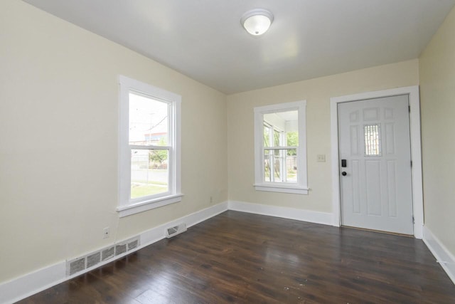 912 Harvey St, Beloit, WI 53511 - entrance foyer with dark wood-style floors and baseboards