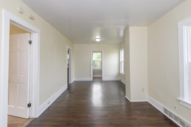 912 Harvey St, Beloit, WI 53511 - unfurnished room featuring dark wood finished floors and baseboards