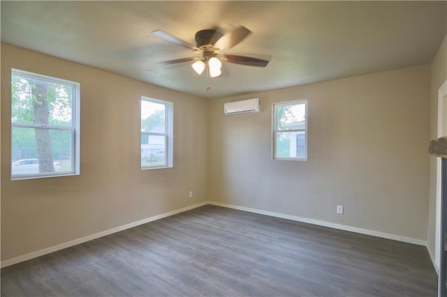 1226 Bellevue Ave, Eau Claire, WI 54703 - spare room featuring a wall mounted AC, ceiling fan, dark wood-style floors, and baseboards