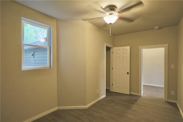 1226 Bellevue Ave, Eau Claire, WI 54703 - spare room with baseboards, wood finished floors, a ceiling fan, and a smoke detector