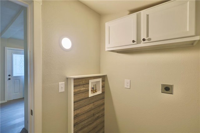1226 Bellevue Ave, Eau Claire, WI 54703 - laundry area featuring electric dryer hookup, hookup for a washing machine, cabinet space, and a textured wall