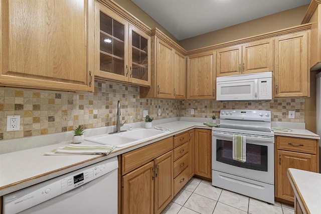 6758 Raymond Rd Unit 109, Madison, WI 53719 - kitchen with white appliances, light countertops, decorative backsplash, and glass insert cabinets