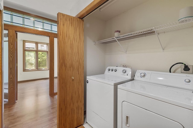 6758 Raymond Rd Unit 109, Madison, WI 53719 - washroom with washer and dryer and light wood-type flooring