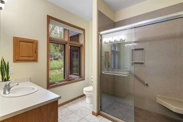 6758 Raymond Rd Unit 109, Madison, WI 53719 - bathroom featuring vanity, a shower with shower door, and tile patterned floors