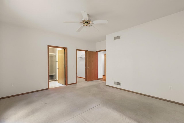 6758 Raymond Rd Unit 109, Madison, WI 53719 - unfurnished bedroom with light colored carpet, a walk in closet, connected bathroom, a closet, and ceiling fan