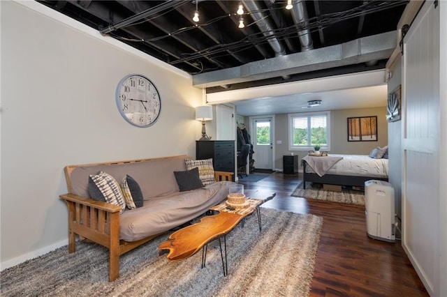 living room with wood finished floors and baseboards