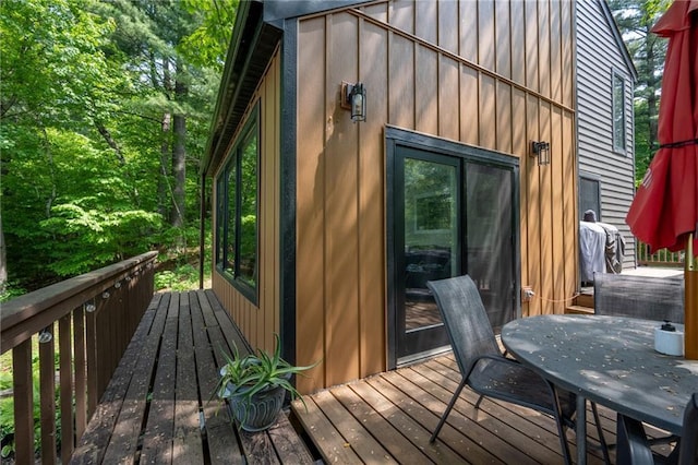 wooden deck featuring outdoor dining space