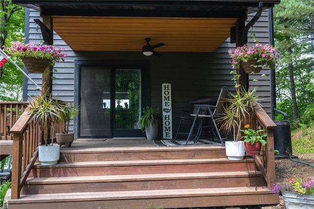 doorway to property featuring a ceiling fan