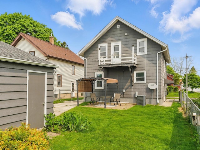 409 Huron St, Manitowoc, WI 54220 - rear view of property with a patio, a balcony, and central AC