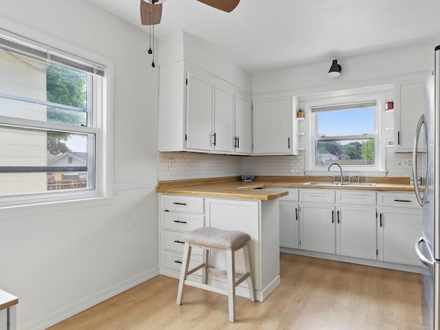 409 Huron St, Manitowoc, WI 54220 - kitchen with a sink, plenty of natural light, and light wood-type flooring