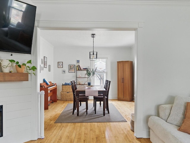 409 Huron St, Manitowoc, WI 54220 - dining room with light wood-style floors and ornamental molding