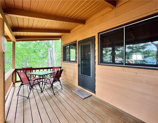 24730 Scenic View Ln, Spooner, WI 54801 - wooden deck featuring outdoor dining space