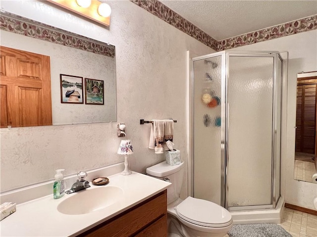 24730 Scenic View Ln, Spooner, WI 54801 - bathroom with a textured wall, vanity, a stall shower, a textured ceiling, and toilet