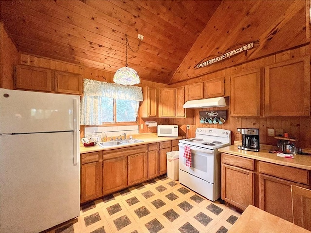 24730 Scenic View Ln, Spooner, WI 54801 - kitchen with white appliances, a sink, under cabinet range hood, vaulted ceiling, and brown cabinetry