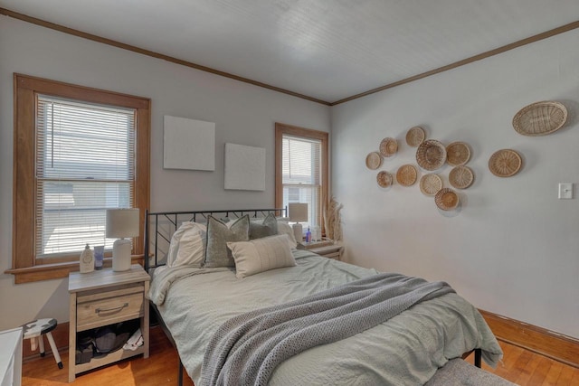 2116 N 60th St Unit 2118, Milwaukee, WI 53208 - bedroom with crown molding, light wood-type flooring, and baseboards