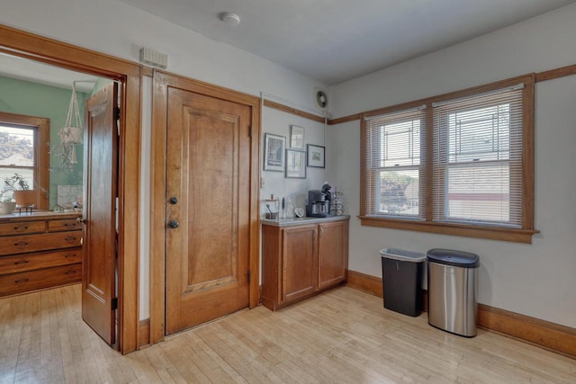 2116 N 60th St Unit 2118, Milwaukee, WI 53208 - bar area with light wood-type flooring and baseboards