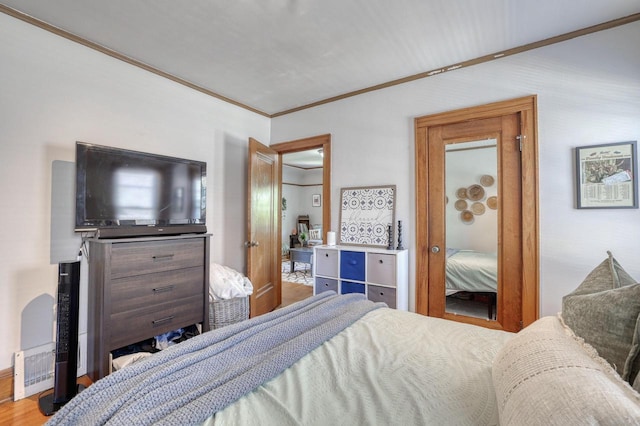 2116 N 60th St Unit 2118, Milwaukee, WI 53208 - bedroom featuring crown molding and wood finished floors