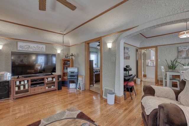 2116 N 60th St Unit 2118, Milwaukee, WI 53208 - living room with a textured wall, ceiling fan, a textured ceiling, ornamental molding, and wood finished floors