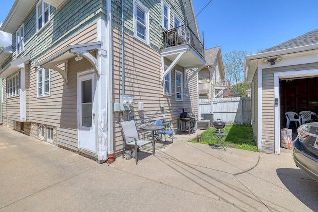 2116 N 60th St Unit 2118, Milwaukee, WI 53208 - view of property exterior with a patio, a balcony, and cooling unit