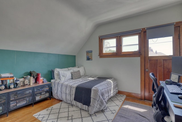 2116 N 60th St Unit 2118, Milwaukee, WI 53208 - bedroom with lofted ceiling, light wood finished floors, and an office area