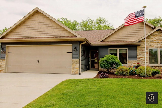 2253 Walnut St, Beloit, WI 53511 - craftsman-style home featuring stone siding, driveway, a garage, a front lawn, and roof with shingles